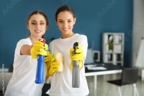 Janitors with cleaning supp...