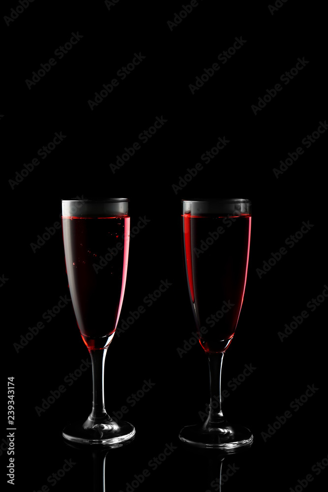 Glasses of rose champagne on dark background Glasses of rose champagne on dark background