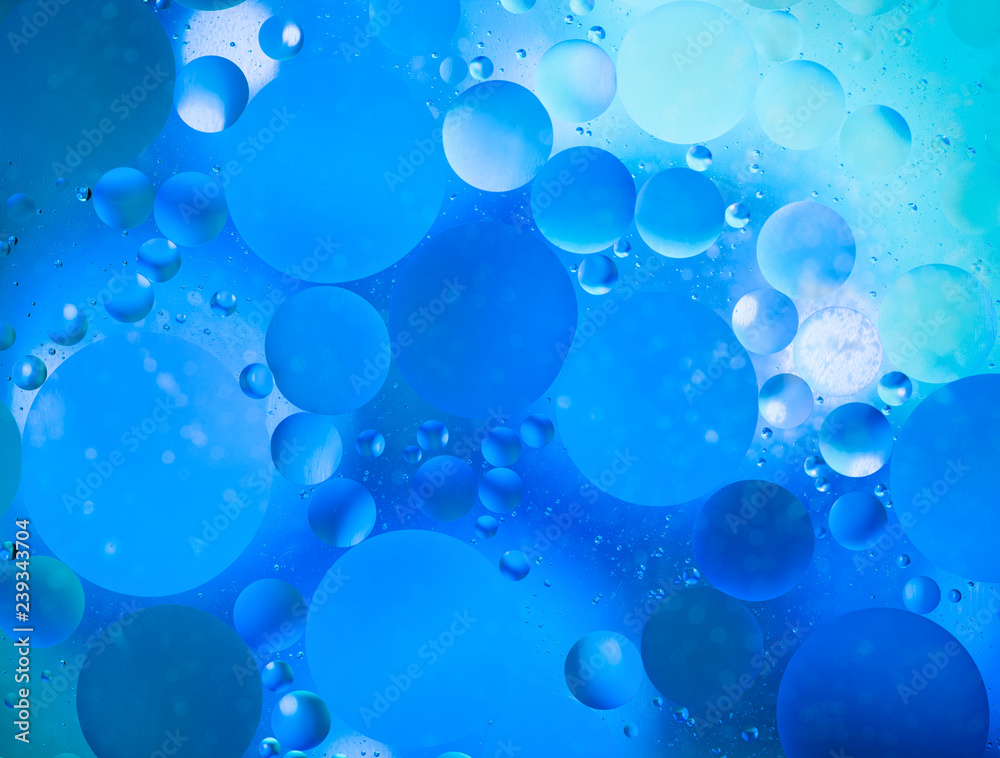 water drops on glass with colorful background, close-up 