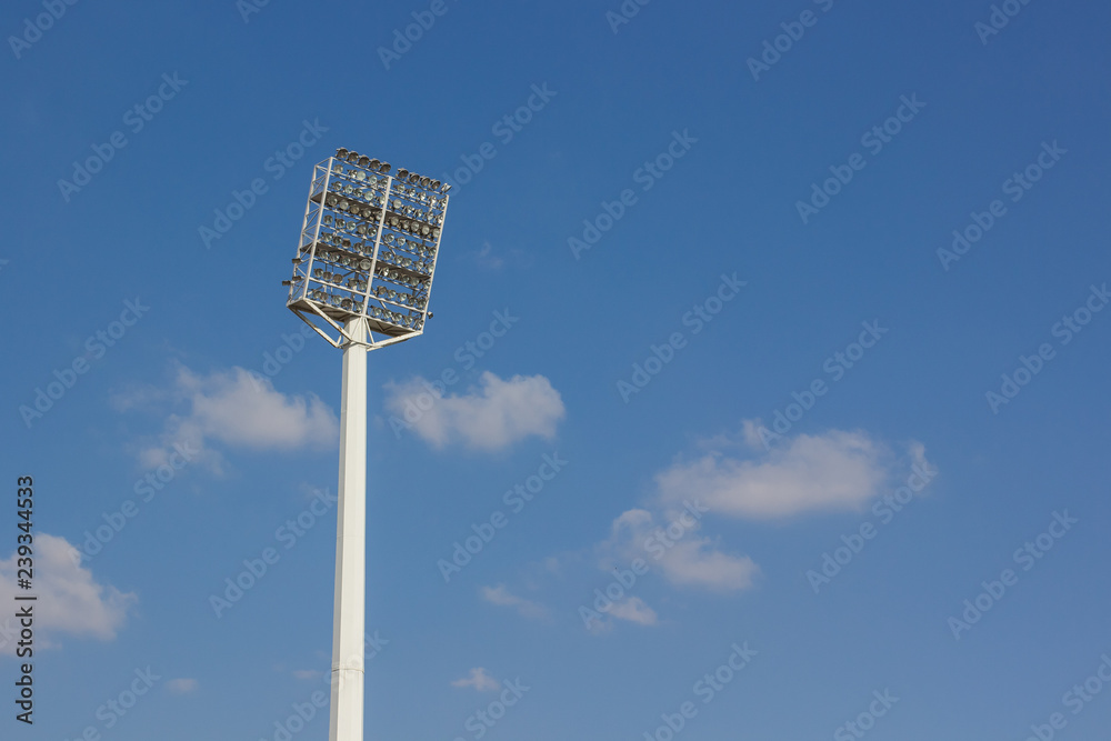 high pillar with spotlight in clear bright day time on blue sky background, copy space high pillar with spotlight in clear bright day time on blue sky background, copy space