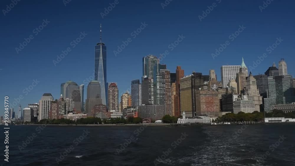 Skyline with famous skyscrapers of Manhattan and East River. Water tour to the island of Liberty. Skyline with famous skyscrapers of Manhattan and East River. Water tour to the island of Liberty.