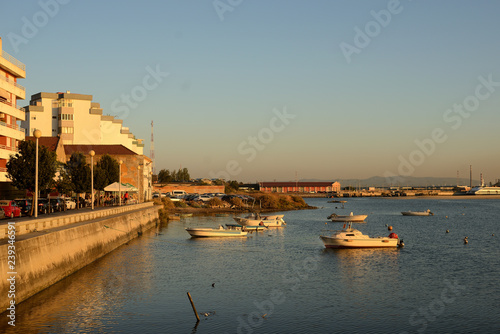 sunset overlooking the bay and boats, barreiro, lisbon photo