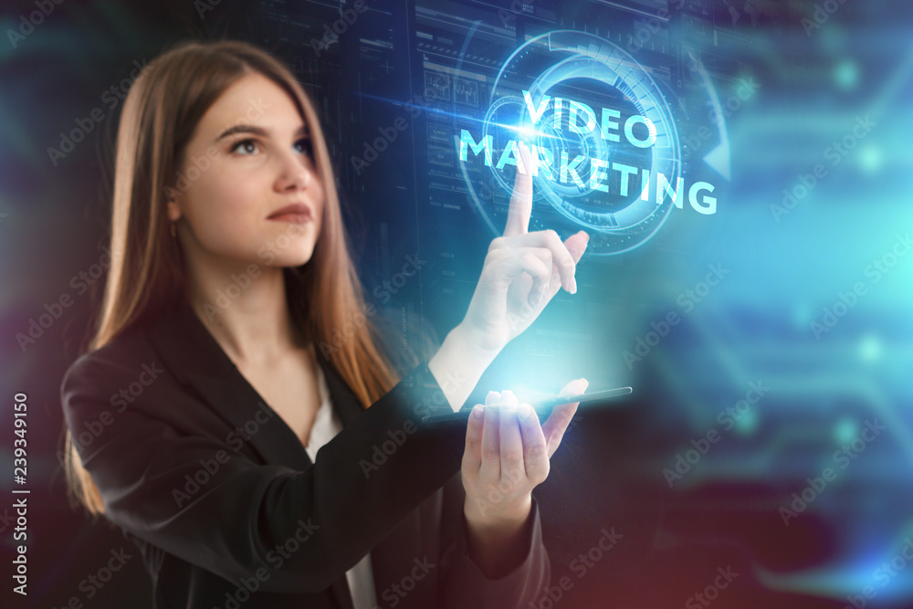 The concept of business, technology, the Internet and the network. A young entrepreneur working on a virtual screen of the future and sees the inscription: Video marketing The concept of business, technology, the Internet and the network. A young entrepreneur working on a virtual screen of the future and sees the inscription: Video marketing