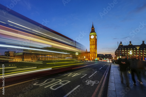 Doubledecker bus runs towards Big Ben (Elizabeth Tower), located north end of the Palace of Westminster, London, England, United Kingdom, Europe photo