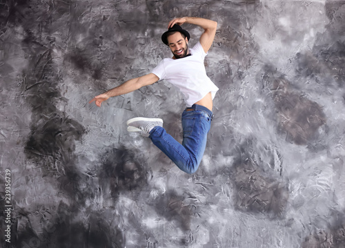 Jumping male dancer against...