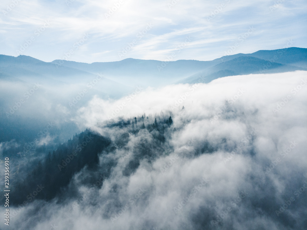 aerial view of clods and fog over mountains hills. magic time aerial view of clods and fog over mountains hills. magic time