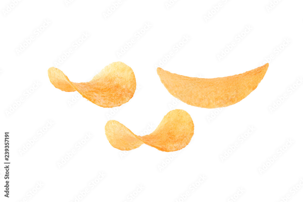 Tasty crispy potato chips on white background Tasty crispy potato chips on white background