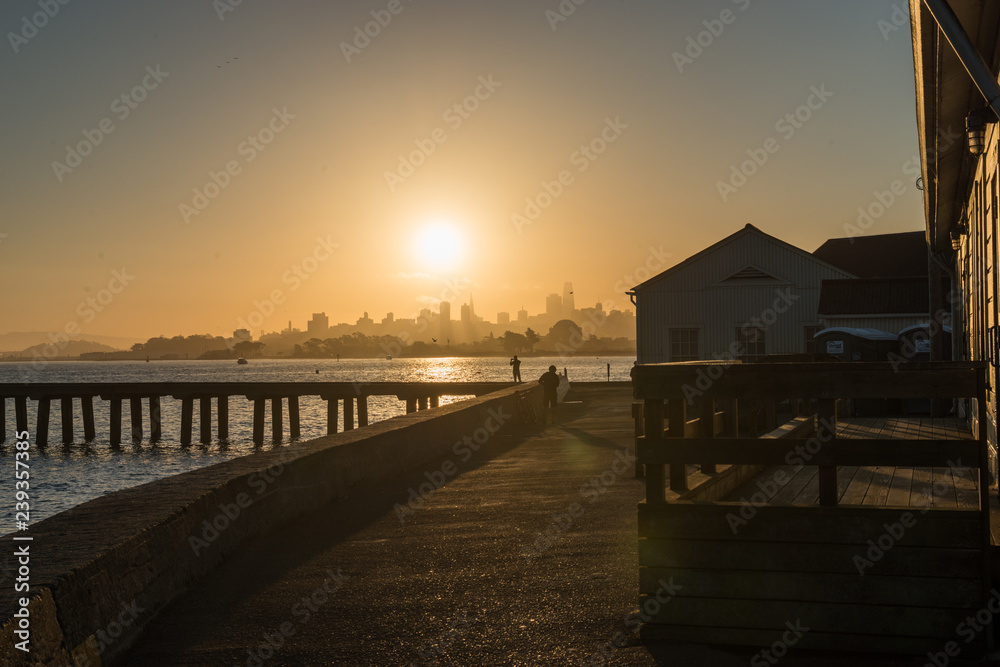 Torpedo Wharf and downtown silhouette at sunrise in San Francisco