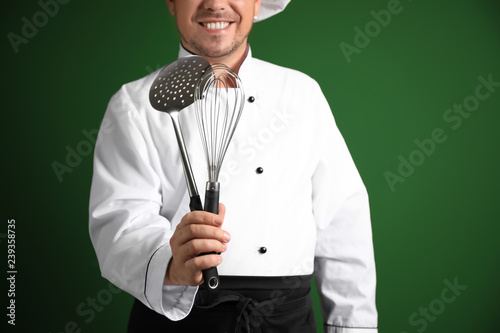 Male chef with kitchen uten...
