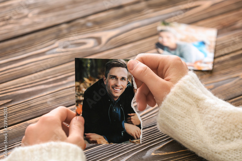 Woman holding torn part of ...