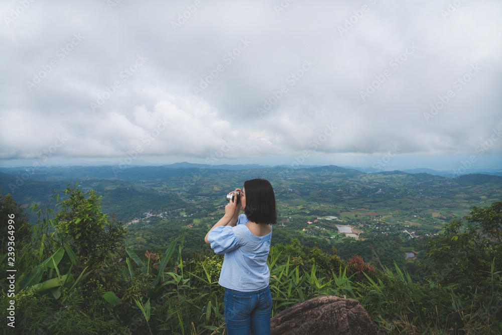 Happy young cute asian Japanese girl hipster backpack photography women taking a photo  at beautiful sky mountains scenery views