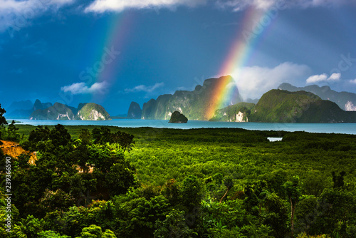 A rainbow appears over the island of Phuket. This ocean of India tropical island is one of the most beautiful in the world.