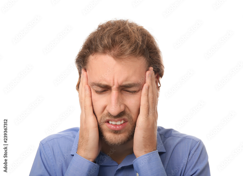 Young man suffering from headache on white background Young man suffering from headache on white background