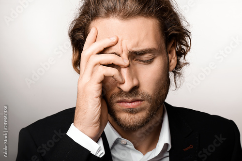 Stressed Young Man with Hea...
