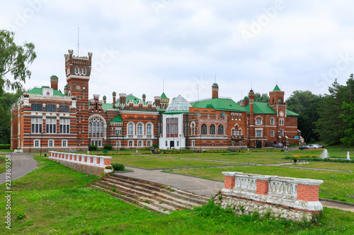 Sheremetev castle palace and park ensemble in the village of Yurino on the bank of the Volga, combination of different architectural styles in one building. Cloudy weather at the beginning of summer.