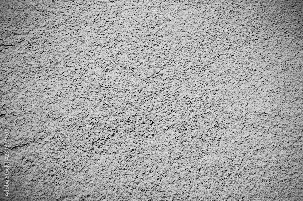 Fototapeta premium Beige wall texture background. Ribbed surface with holes and scratches.