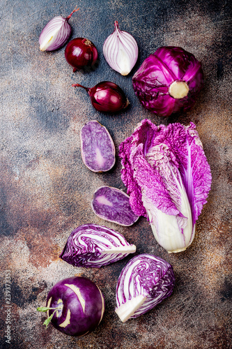 Seasonal winter autumn purple vegetables on rustic background. Plant based vegan or vegetarian cooking concept. Clean eating food, alkaline diet © sveta_zarzamora