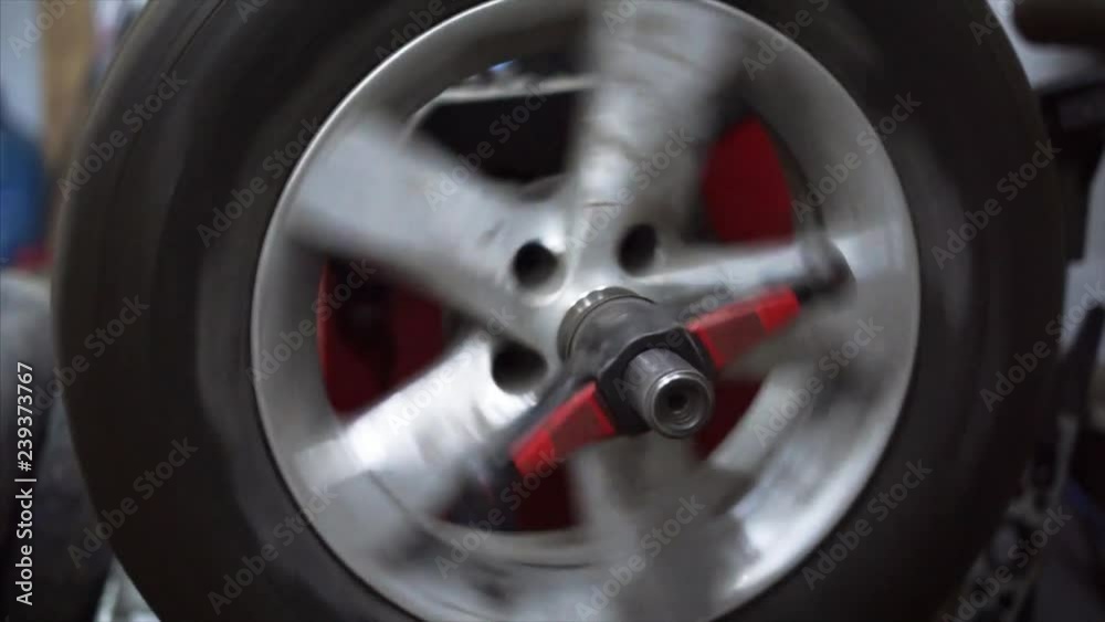Balancing wheels in a service. Balancing wheels in a service.
