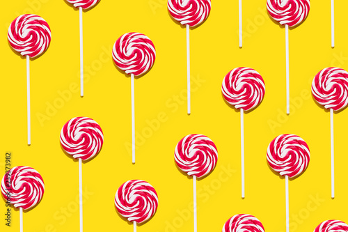Red lollypop on yellow background