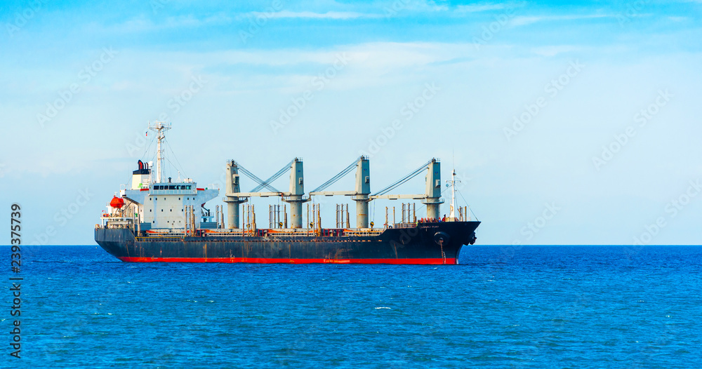 View of the cargo ship in the port of Cebu, Philippines. Copy space for text.