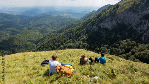 Group of friends hiking through Buila Vanturarita National Park in Romania photo