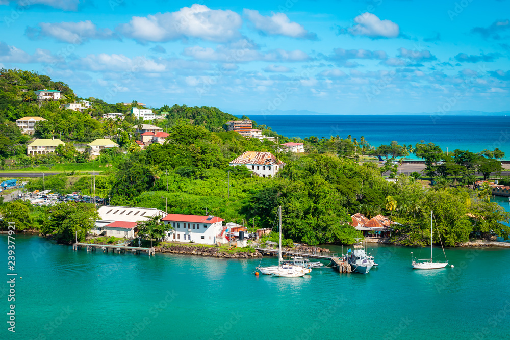 Beautiful view of marina at St Lucia, Caribbean. Houses along and on the hill close to the harbor of Castries.