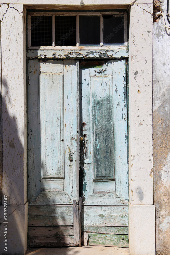 Old shabby door in the sun