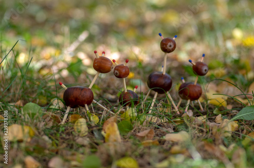 Group of funny chestnut animals in green grass, traditional autumn handcraft, European roe deer with family © Iva