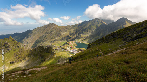 Girl hiking through Fagaras mountains in Romania.