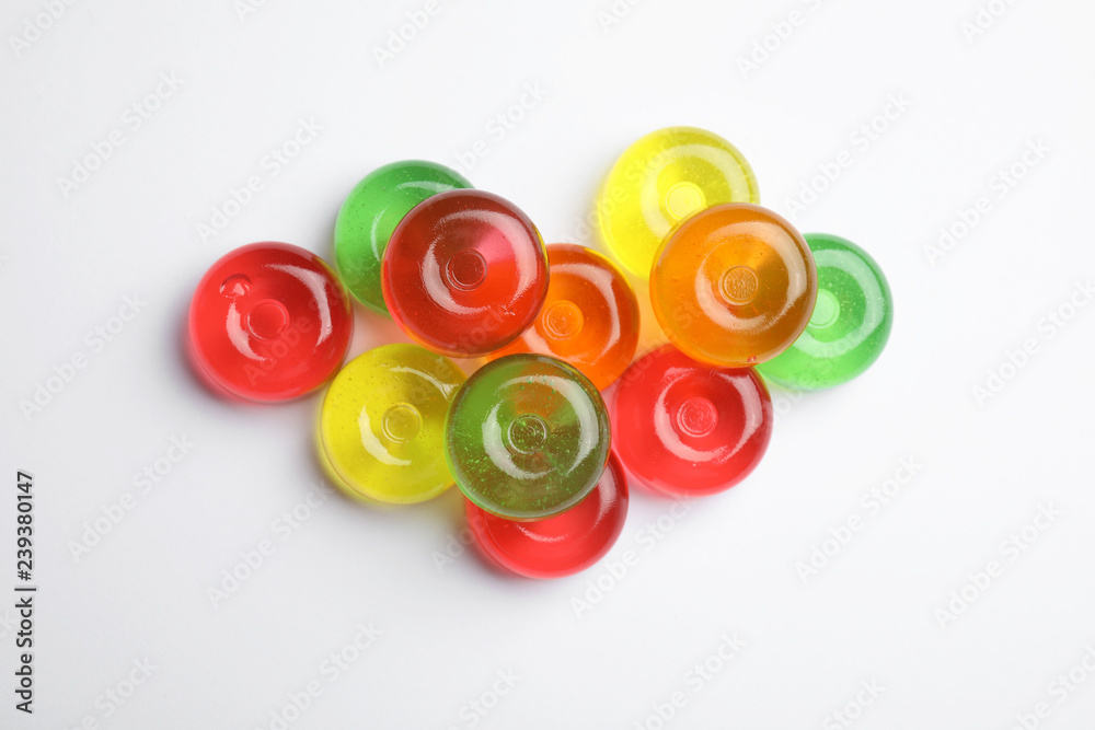 Delicious colorful candies on white background, top view Delicious colorful candies on white background, top view