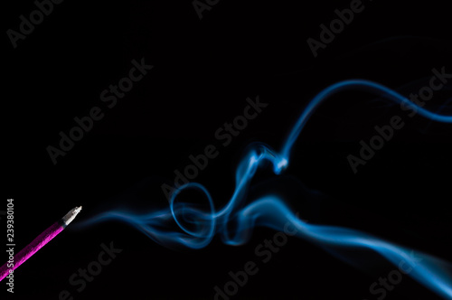 Incense stick on a black background