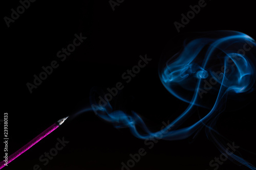 Incense stick on a black background