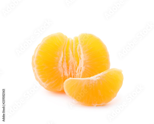 Pieces of fresh ripe tangerine on white background