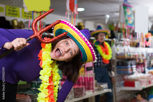 woman  is trying things in store of festival outfits