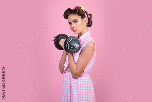 powerful housewife. pin up woman with trendy makeup. retro woman with dumbbell. Sport. pretty girl in vintage style. pinup girl with fashion hair. Up to speed with their fitness goals