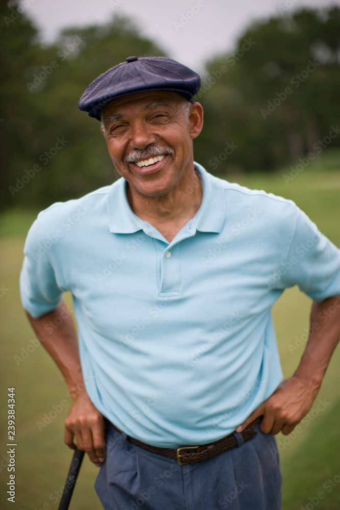Portrait of a smiling senior man wearing a golf cap. Portrait of a smiling senior man wearing a golf cap.