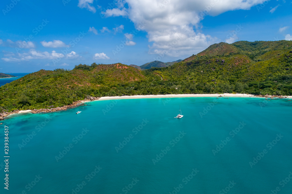Fototapeta premium Aerial view of beautiful island at Seychelles in the Indian Ocean. Top view from drone