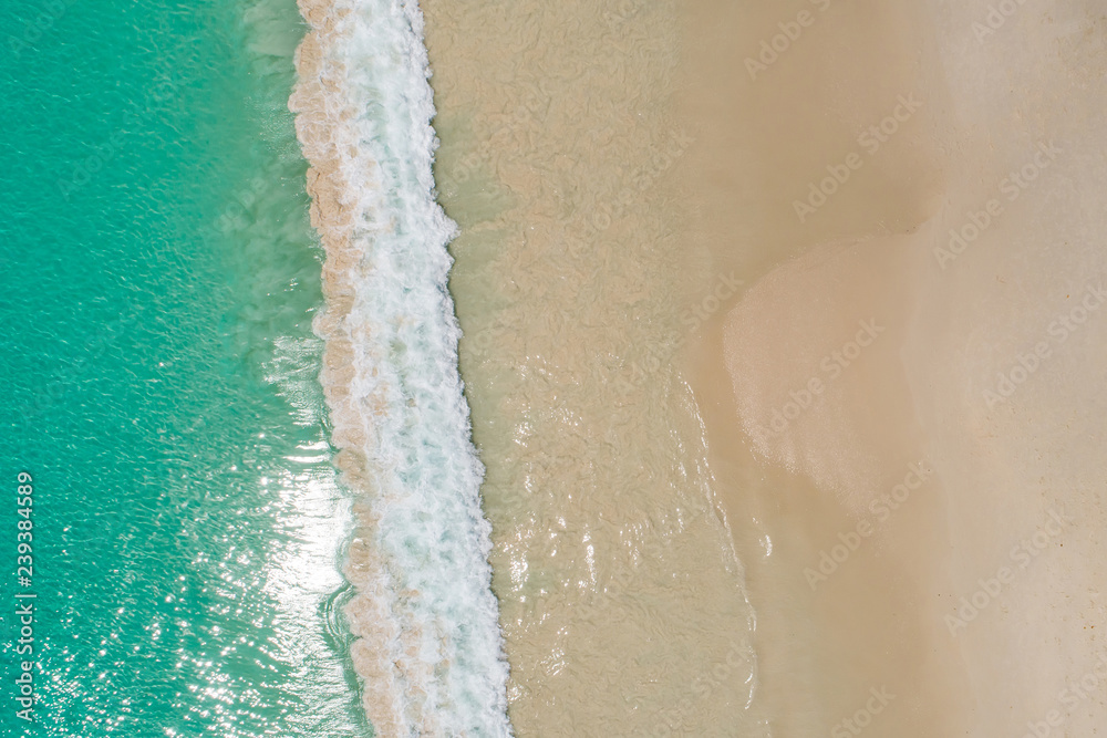 Aerial top view beautiful sea landscape, beach and wave with turquoise sea water with copy space