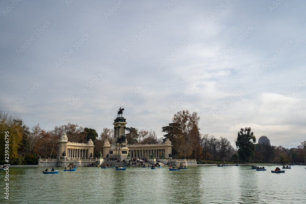 Peaceful lake and Monument to King Alfonso XII in Parque del Buen Retiro. Buen Retiro Park - one of largest parks of Madrid City. Spain.