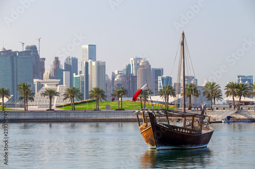 Shuwai dhow in Doha museum lagoon with towers skyline