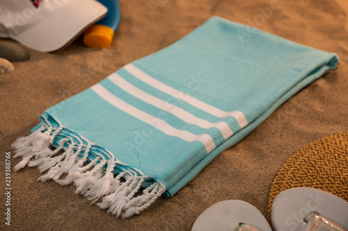 Handwoven hammam Turkish cotton towel on beach