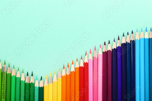 Colored pencils on mint background