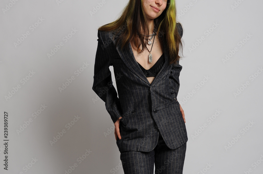 frau im anzug hosenanzug business outfit strip ausziehen nackt bh dessous  Stock Photo | Adobe Stock