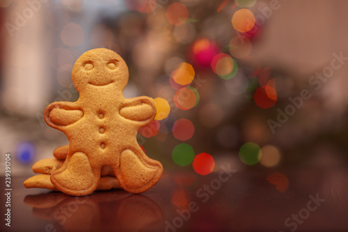 Christmas homemade gingerbread cookies on colorful bokeh background.