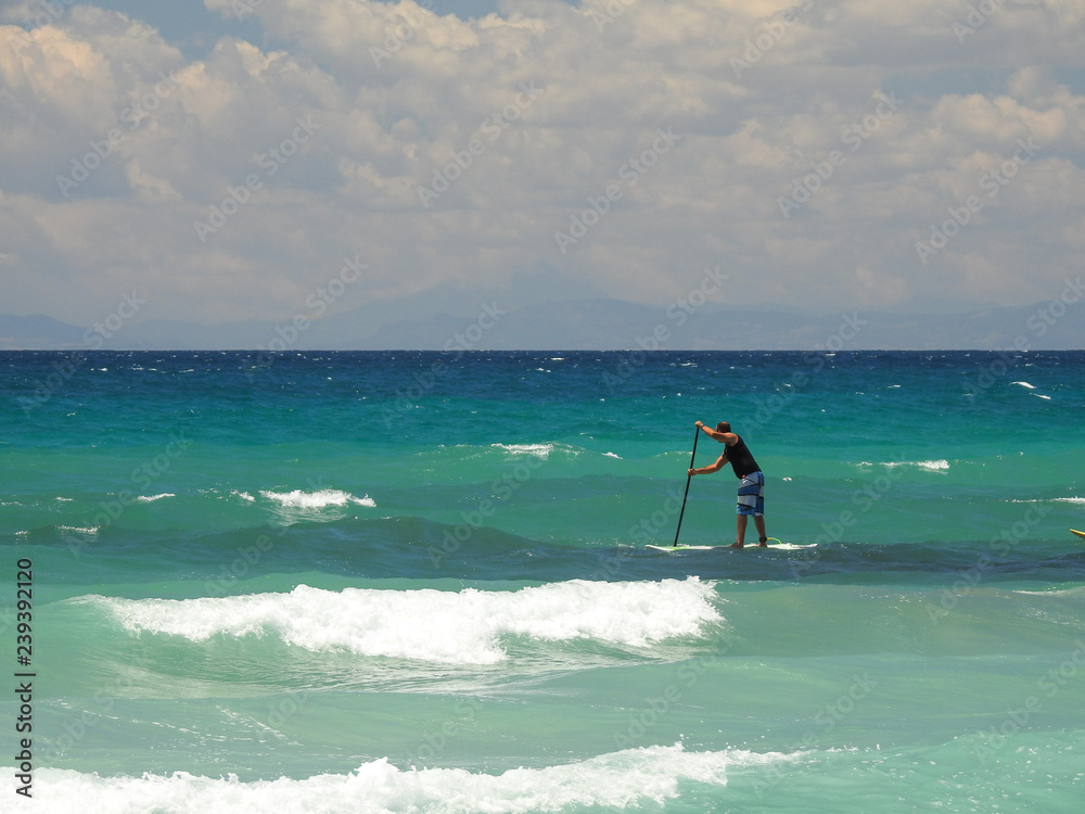 SUP surf in mare spiaggia Puglia Taranto Italia SUP surf in mare spiaggia Puglia Taranto Italia