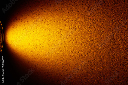 Wide orange lantern light on a black background