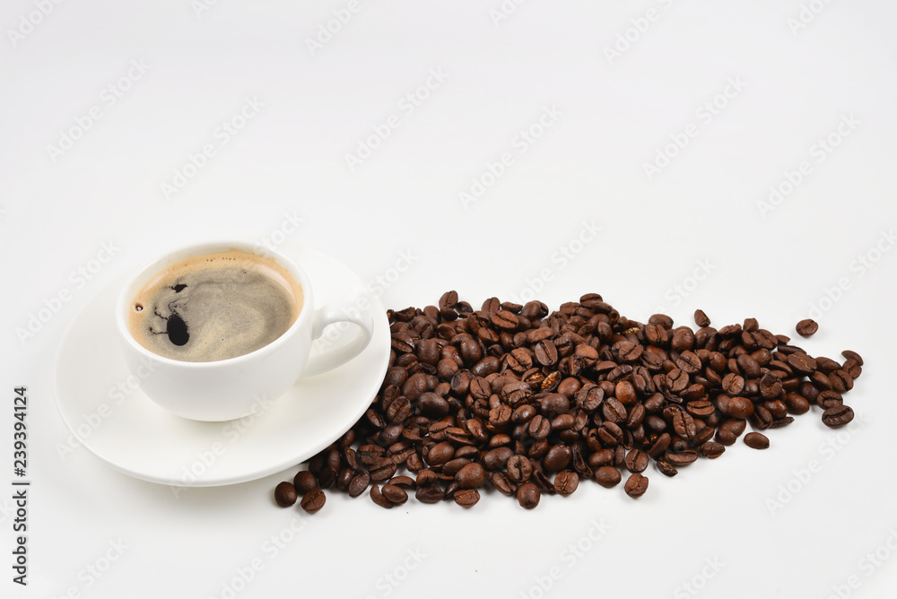 Cup of coffee and coffee beans on a white background. Cup of coffee and coffee beans on a white background.