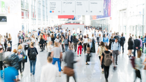 blurred business people at a trade fair