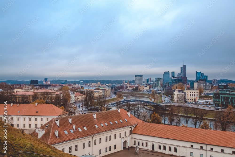 Evening view from remaining part of the Upper Vilna Castle, near Gediminas' Tower, on Skyscrapers of New Center and Neris river, Vilnius (Republic of Lithuania). October 23, 2018.