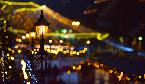 street lamp on the background of holiday lights